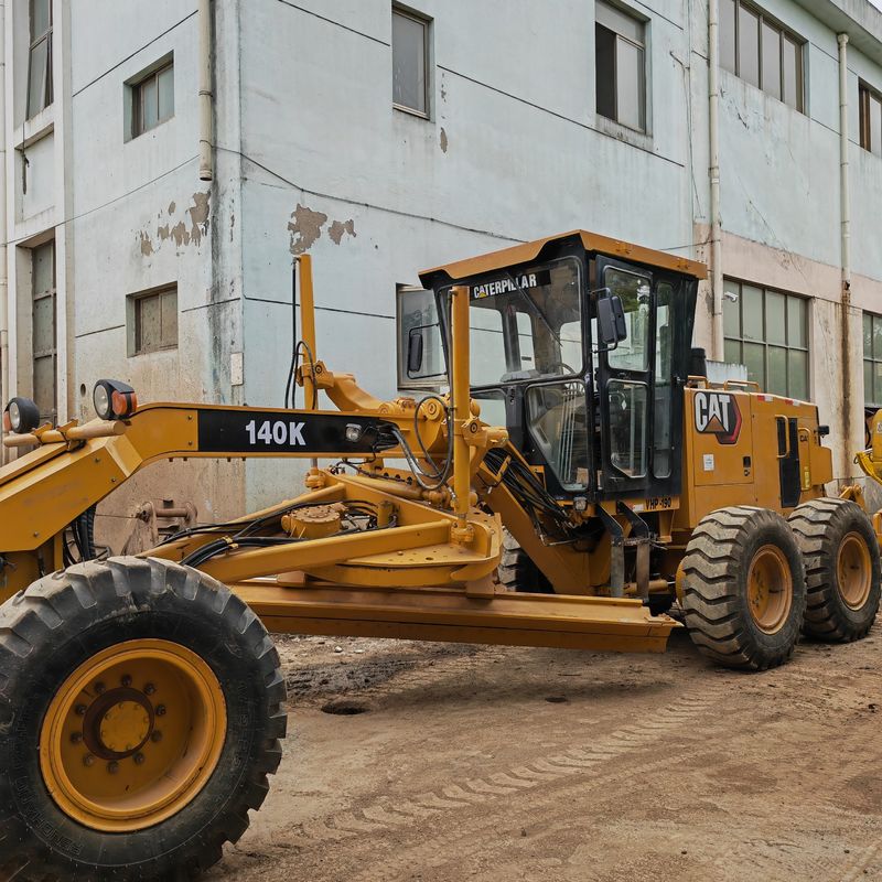 Used excavator land leveller Caterpillar CAT140K roader machine secondhand japan tractor engine  in good condition